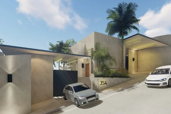 Stylish gated community entrance with contemporary design and lush greenery.