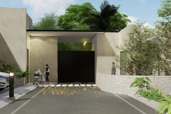 Entrance to a gated community featuring a modern design, a pedestrian with a stroller, and natural greenery.